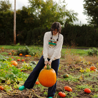 Model is 5'11 wearing Let the Ghoul Times Roll Crewneck Sweater in Large